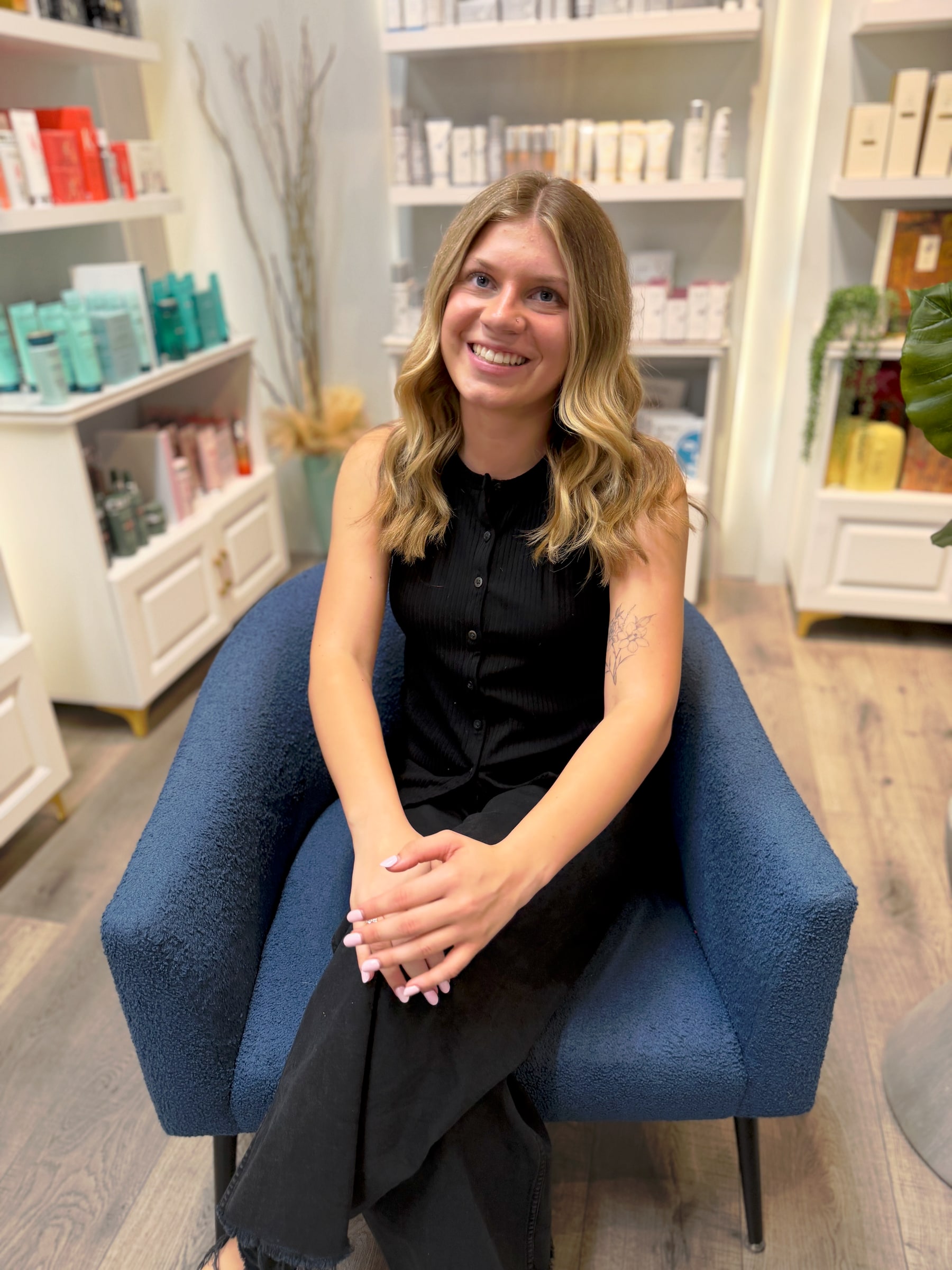 Morgan Holm seated in the salon